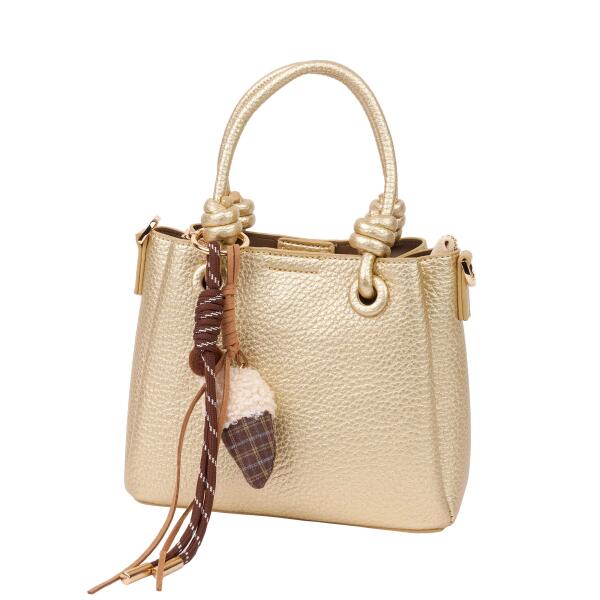 A stylish handbag with a decorative charm. image 1