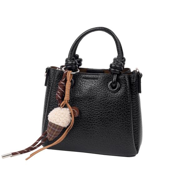 A stylish handbag with a decorative charm. image 3