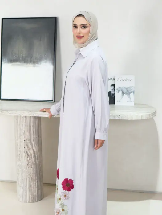 A dress decorated with roses image 2