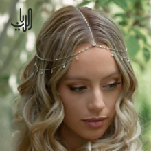 زينه للرأس انيقه ذهبيه اللون بالكريستالات image 0